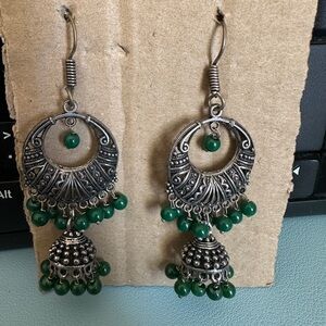 Pair or silver Jhumka earrings with green beads